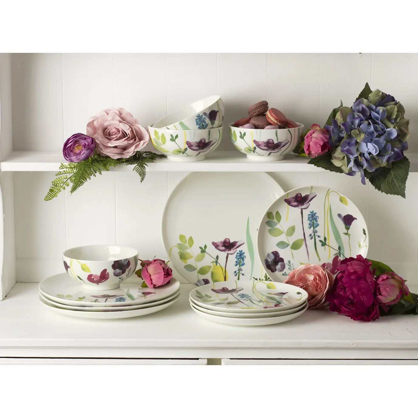 Close-up of the Portmeirion Water Garden 12 Piece Dinner Set showcasing colourful flowers on dinner plates, ideal for adding charm to any floral dinner set.