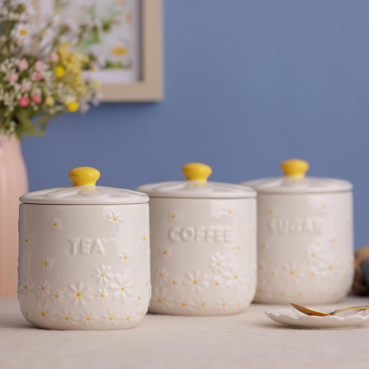 The airtight coffee storage jar from Price & Kensington featuring delicate daisy embossments and a cream glaze.
