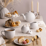 Price & Kensington Luxe 2 Tier Cake Stand White assembled, ideal for serving cakes at parties. This two tier cake stand combines elegance with functionality.