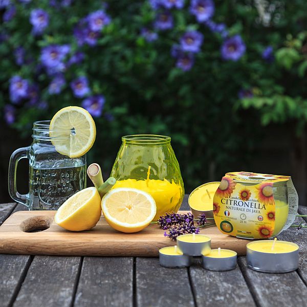 Stylish setup of Price's Candles Citronella Glolite on a patio table, ideal for summer evenings with citronella candles outdoor.