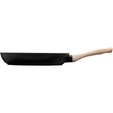 Profile shot of the Pyrex Cook & Care recycled aluminium frying pan with a stylish wood effect handle, suitable for all cooking surfaces.