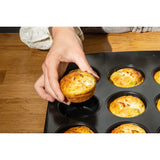 Pyrex Glide 12 Muffin and Cupcake Tray, featuring its ergonomic handle and non-stick muffin tray for effortless baking.
