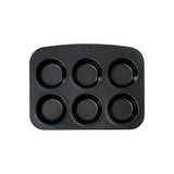 Lifestyle image of the Pyrex Glide 6 Muffin and Cupcake Tray filled with freshly baked muffins and cupcakes.