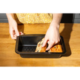 Close-up of the Pyrex Glide Loaf Tin's non-stick coating, demonstrating its scratch resistance and easy cleaning features.