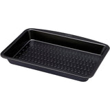 The Pyrex Glide Metal Roaster 38x24cm displayed with its ergonomic design, a must-have non-stick metal roaster for easy handling.