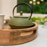 Stylish 30cm Round tray made of mango wood, demonstrating its use as a decorative catch-all mango wood serving tray.