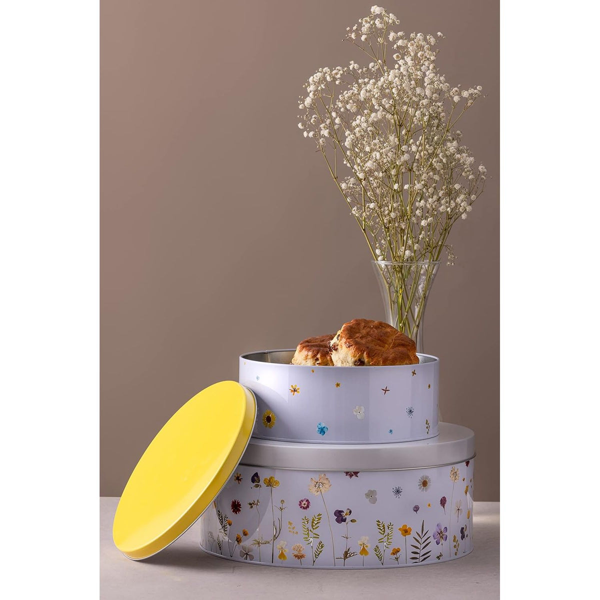 Typhoon Botanics Set of 2 Cake Tins placed next to a vase of flowers, showcasing its use for cake storage tins.