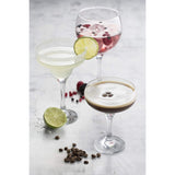 Two Ravenhead Entertain Set 2 Cocktail Saucer Glasses 20cl filled with drinks, perfect coupe cocktail glasses for celebrations.