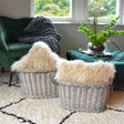 Set of 2 Oval Log Basket in Grey Wash displaying a rustic design for storing logs or blankets.