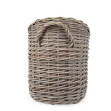 A chic oval scoop log basket in natural tones, perfect for both indoor and outdoor use, featuring the ideal wicker log basket for home enthusiasts.