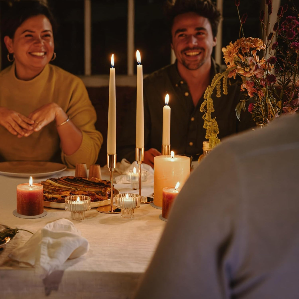 Pack of 14 Spaas tapered dinner candles, unscented and long-lasting, creating warm ambiance for any occasion.
