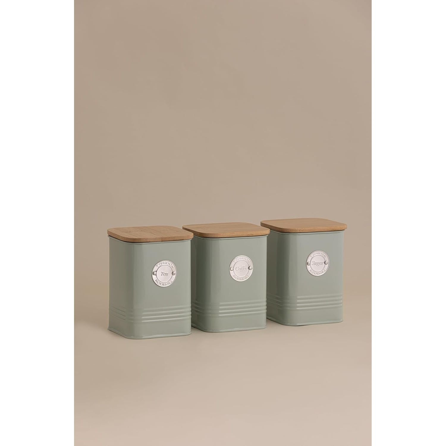 Set of three Typhoon Living Squircle Mint Tea Canisters with bamboo lids, labelled for tea, coffee, and sugar, showcasing their practical use.