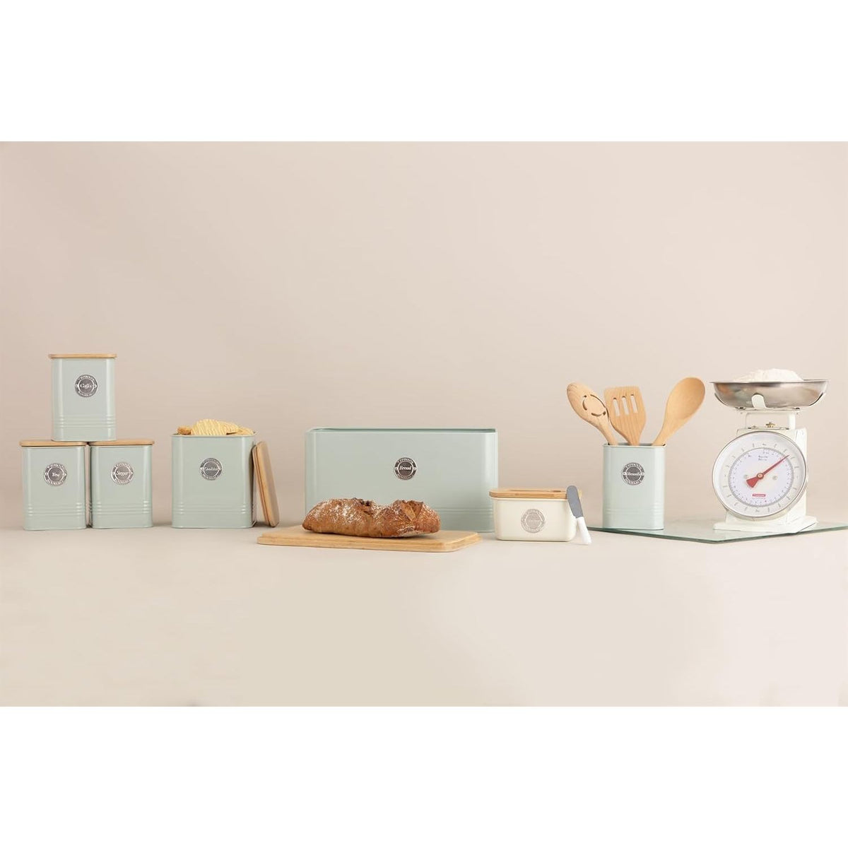 Complete Typhoon Living Squircle Tea Coffee Sugar Storage Set on a kitchen counter, featuring mint green canisters with bamboo lids, providing a chic solution for tea, coffee, and sugar storage.