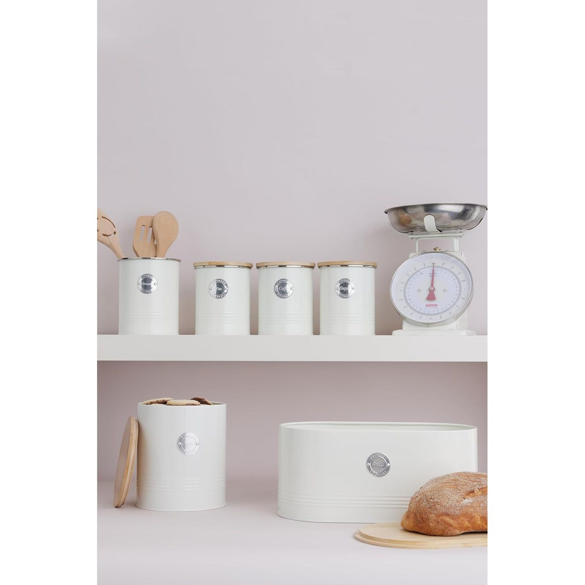 Range of Typhoon Living Cream Tea Canisters on a shelf, showcasing multiple sizes and a coordinated kitchen look.