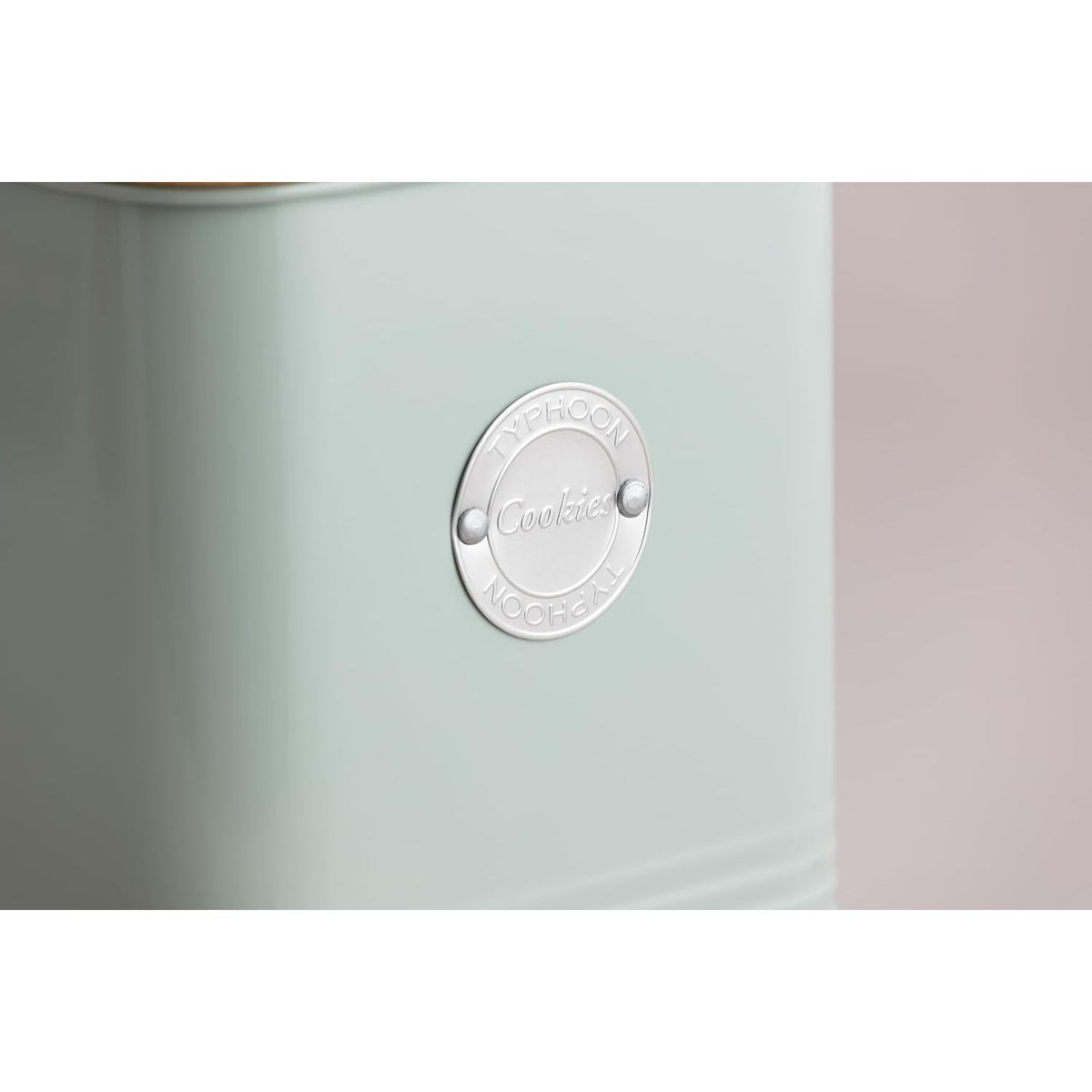 Close-up of the chrome badge on Typhoon Living Squircle Mint Cookie Storage canister, elegantly displaying the 'Cookie' label for a stylish touch.