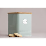 Typhoon Living Squircle Mint Cookie Storage 2.7l canister beside delicious cookies, emphasizing its functionality as an effective cookie storage canister.