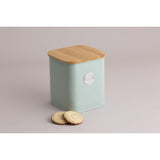 Side view of Typhoon Living Squircle Mint Cookie Storage canister with bamboo lid and cookies, highlighting its design and capacity for cookie storage.