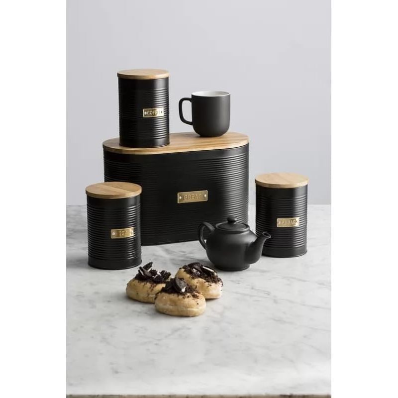 The complete Typhoon Otto Kitchen Storage Canister Set displayed on a marble countertop, featuring tea, coffee, sugar canisters and a bread bin, perfect for stylish kitchen storage.