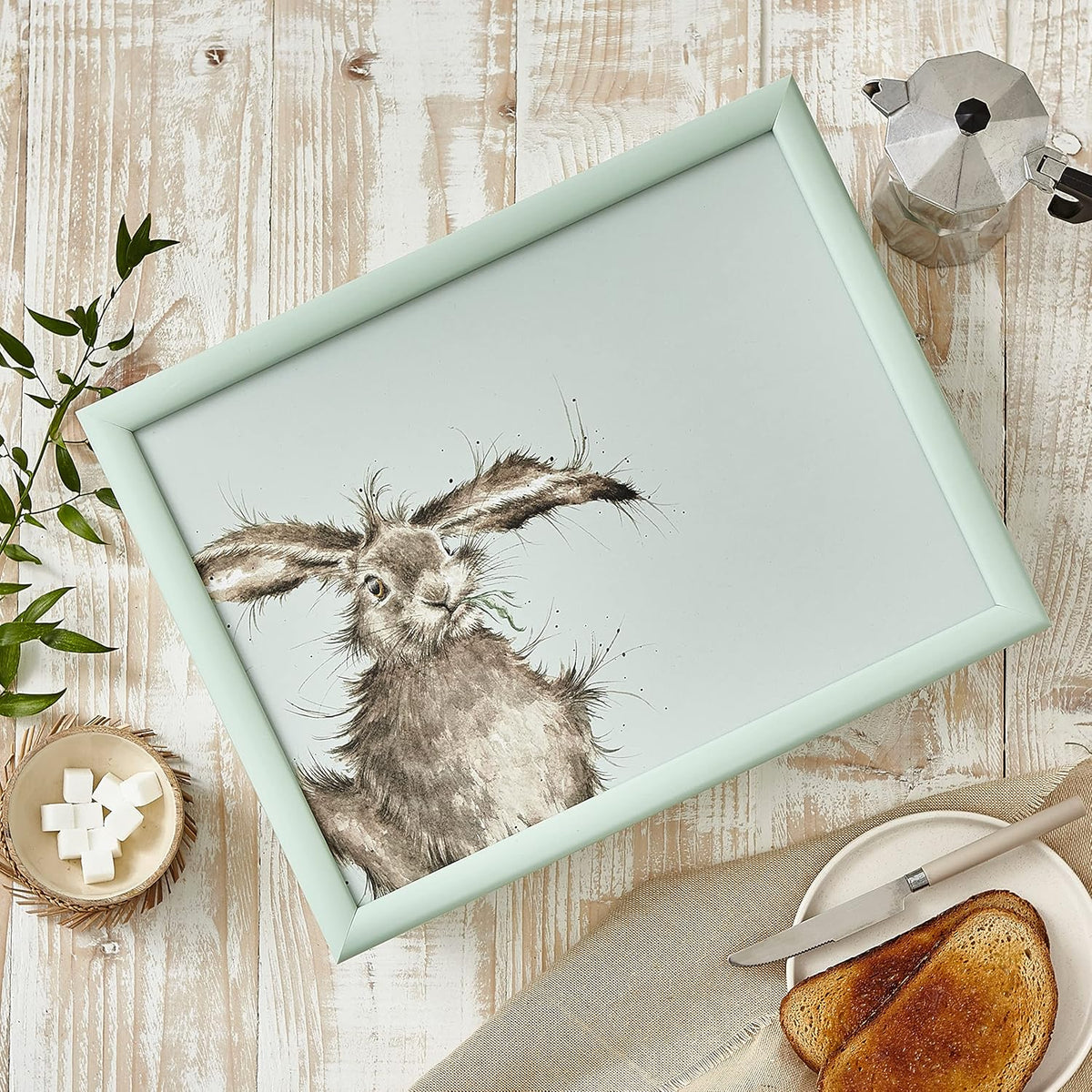 Side view of the Wrendale Designs hare design lap tray highlighting its cushioned feature, perfect for casual dining at home.