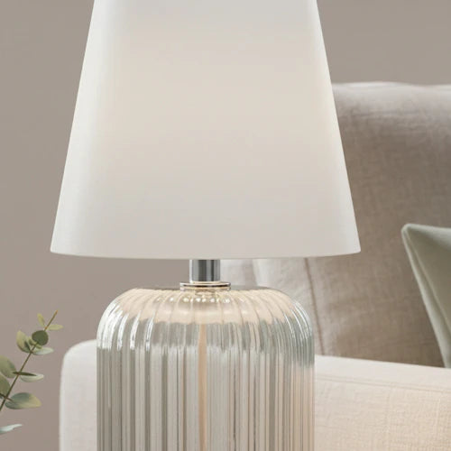 Stylish ridged glass table lamp, showcasing vintage design for modern interiors.