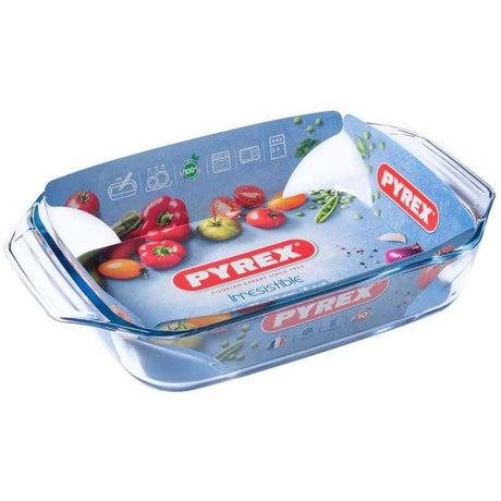 Pyrex Irresistible Glass Rectangular Roaster 31x20 cm, showcasing a glass roasting dish with vibrant vegetable graphics on the packaging.