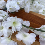 Close-up view of the Silk Cherry Blossom Garland, Cream highlighting the delicate details of the silk cherry blossoms.
