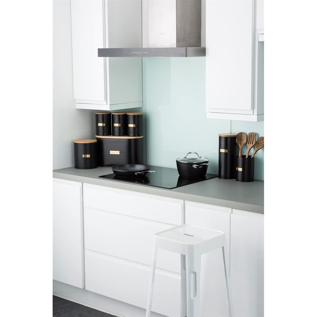 Typhoon Otto Black Cookie Storage canisters in a minimalist kitchen setting, showcasing elegant ribbed details and practical storage solutions.