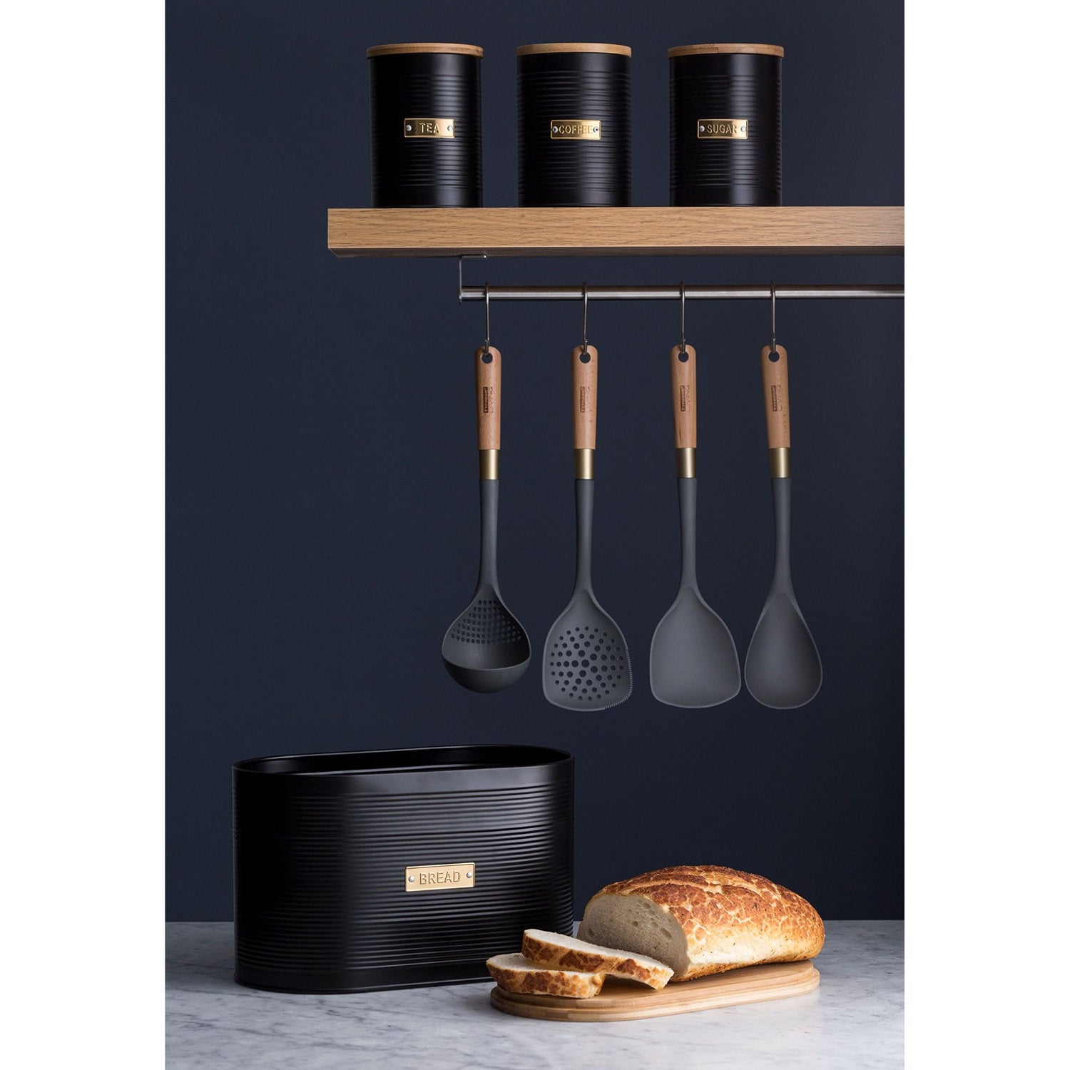 Typhoon Otto Black Set Of 3 Tea/Coffee/Sugar Storage highlighted with tea storage canisters on a countertop, providing storage solutions for any kitchen.